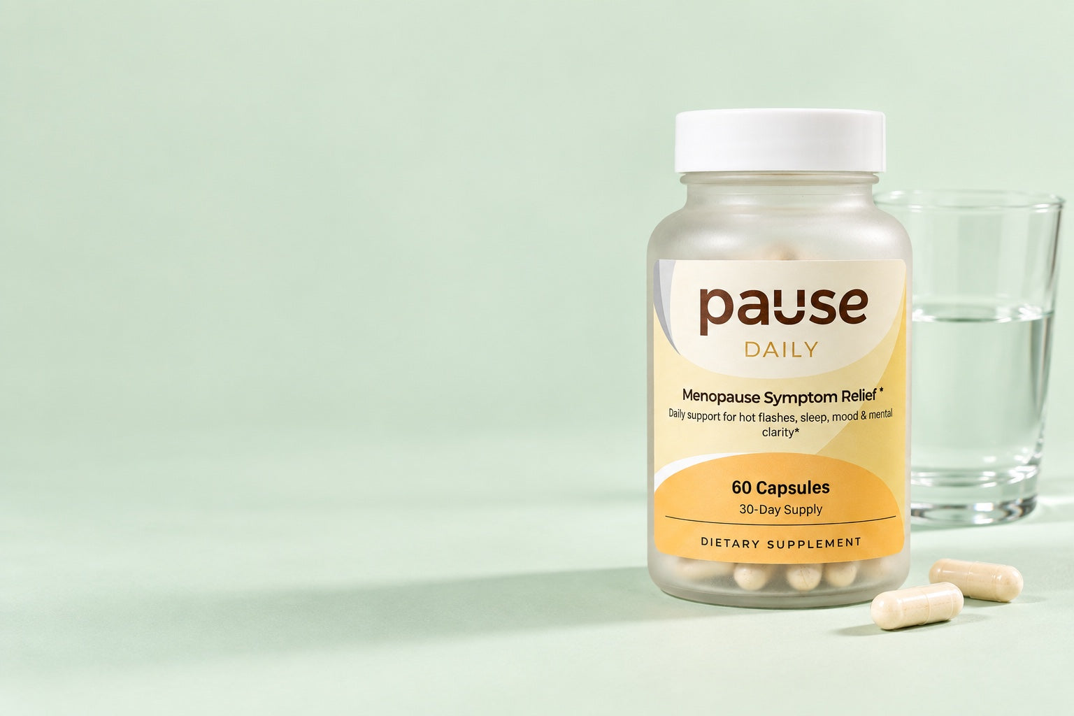 Pause Daily bottle with two capsules and a glass of water
